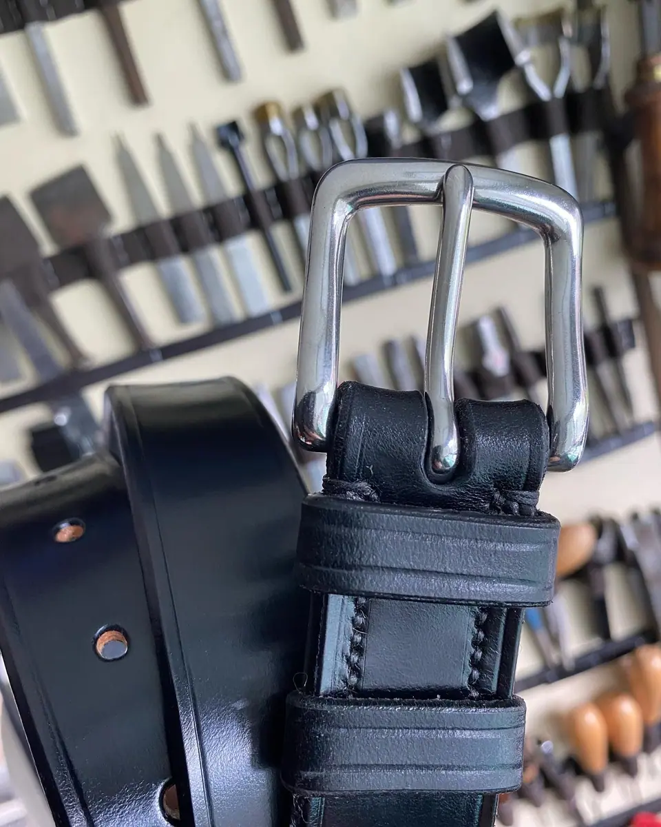 A black belt in front of the tool wall