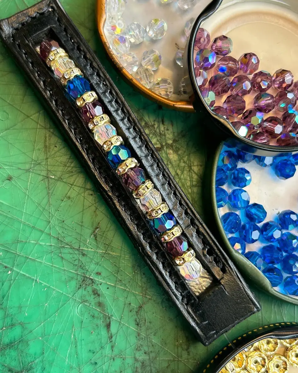 Loose crystals in tins beside a browband in progress