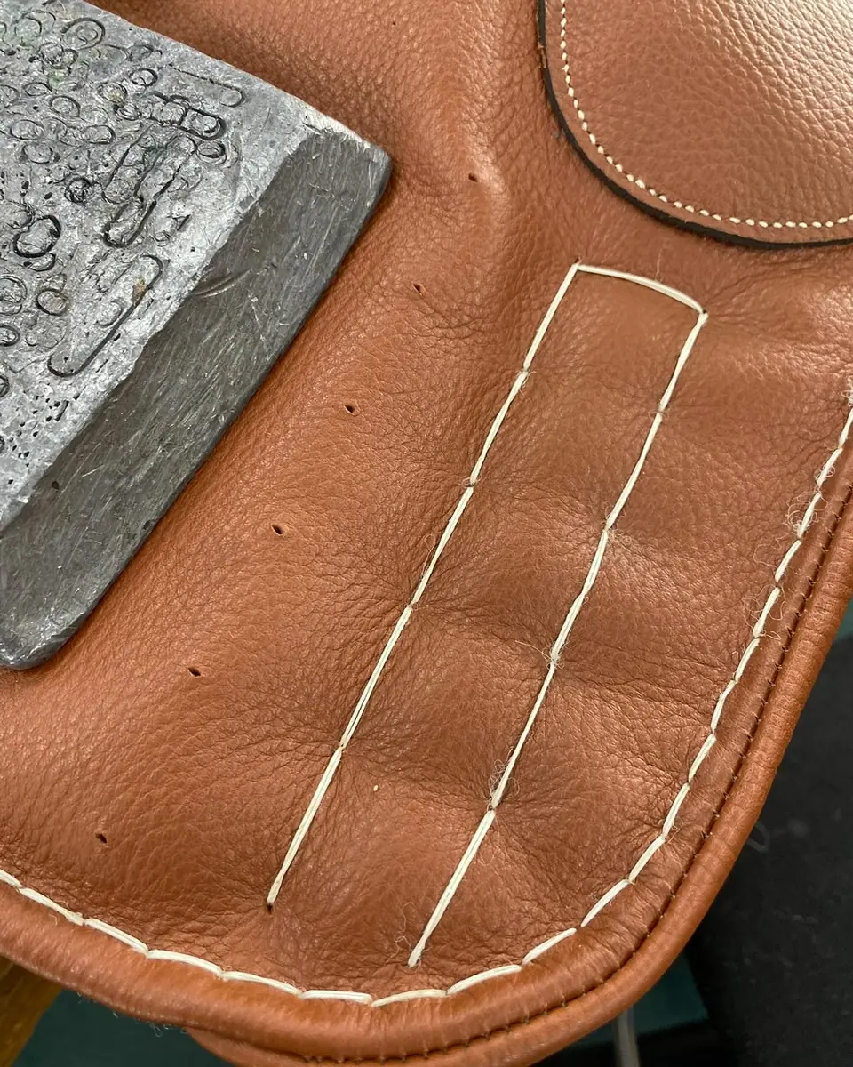 Hand quilting on a side saddle panel