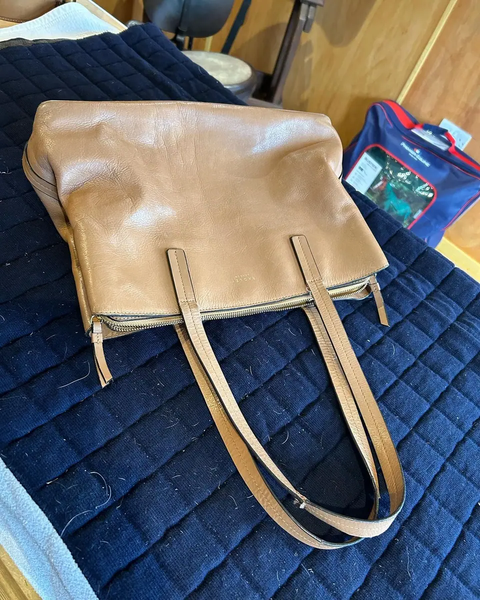 A handbag with new hand-stitched straps