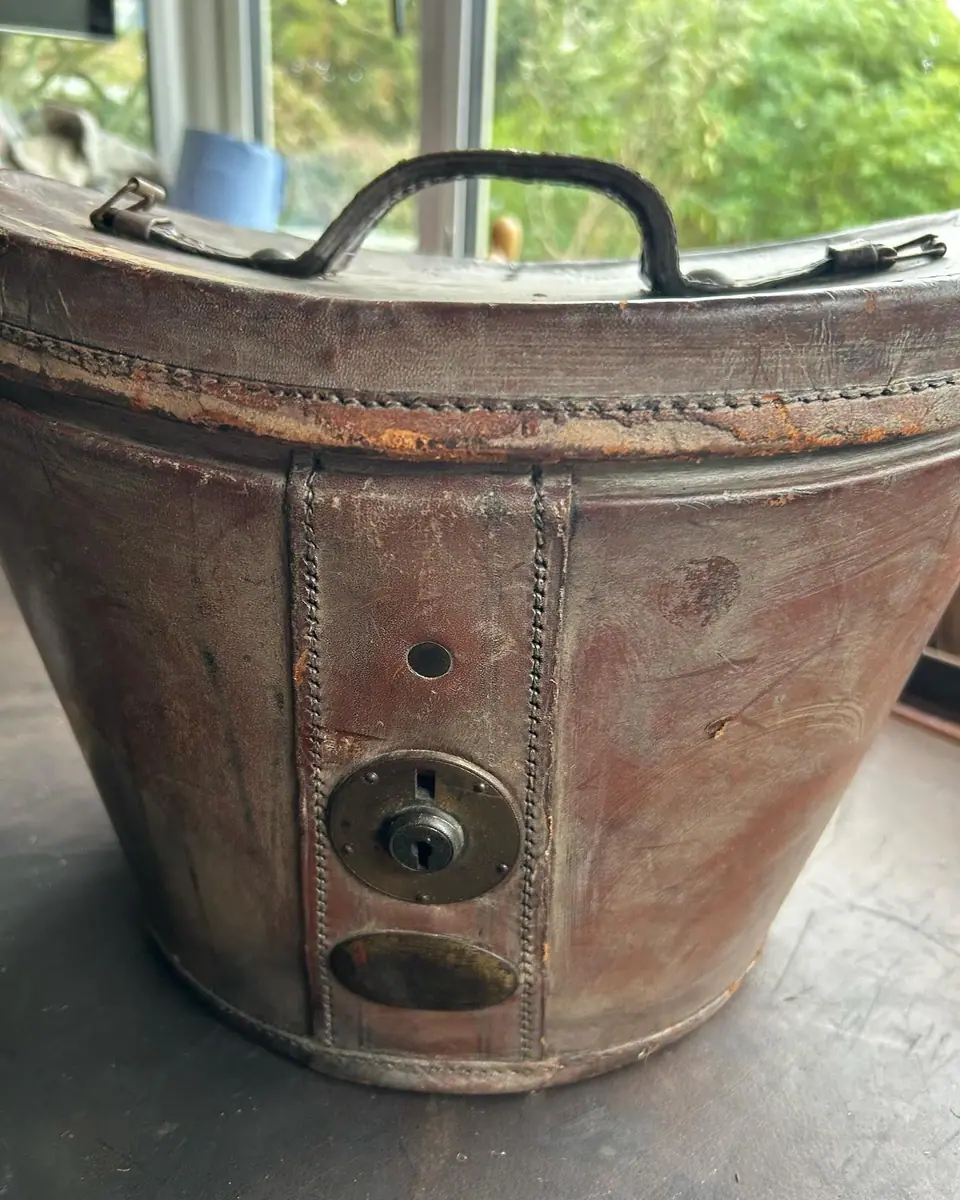 The hat box before, dry and dirty