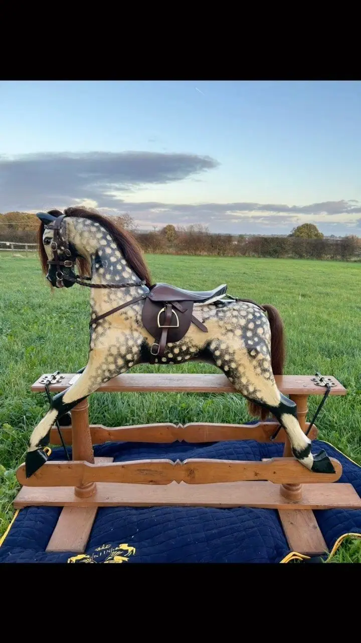 A restored rocking horse wearing new hand-made tack