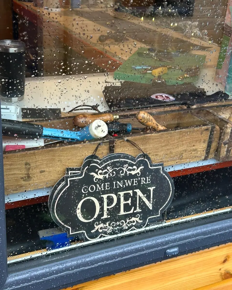 Come in, we're open sign in the shop window