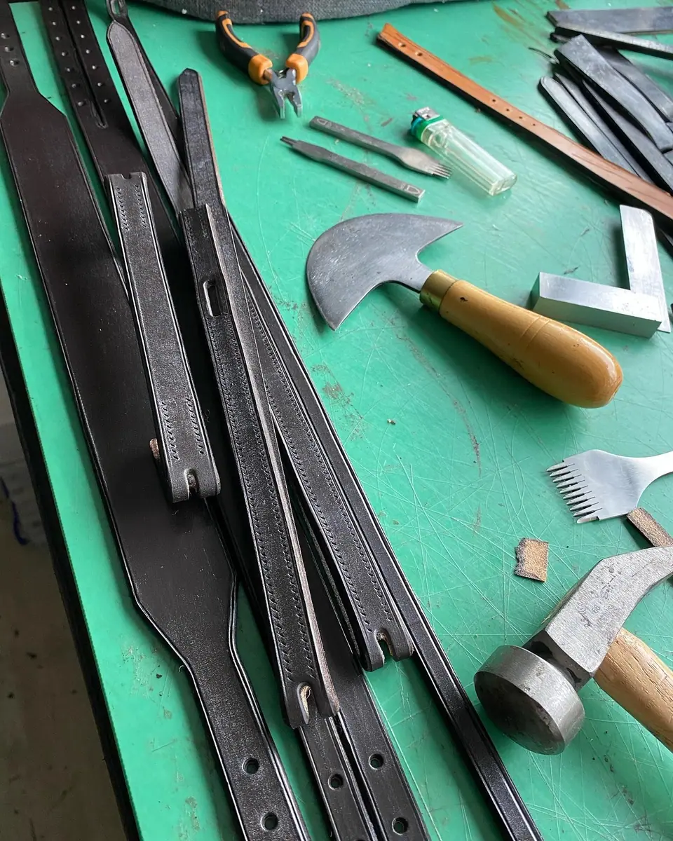 Saddlery hand tools laid out on the bench